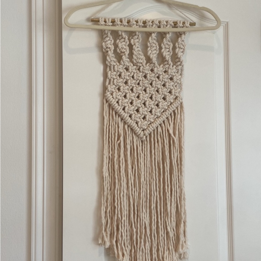 Cream colored macrame wall hanging decoration